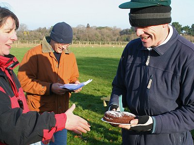 Mark receiving the Welli Boot and Cap from Karen